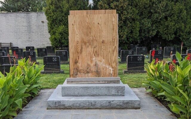 A boarded-up memorial to a Ukrainian SS division in a Catholic cemetery in Elkins Park, Pennsylvania, Sept. 12, 2023. The local Ukrainian Catholic Archeparchy covered up the memorial after Jewish groups condemned it. (Courtesy of Lev Golinkin via JTA)