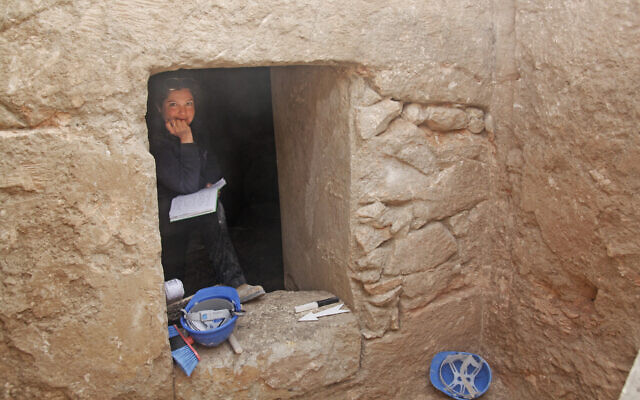 Liat Oz, excavation director, at the entrance to a cave in Jerusalem, in a photo released on September 27, 2023.. (Yotam Asscher/Israel Antiquities Authority)