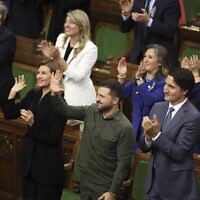 Ukrainian President Volodymyr Zelensky and Prime Minister Justin Trudeau join a standing ovation for Yaroslav Hunka, who was in attendance in the House of Commons in Ottawa, Ontario, on September 22, 2023. (Patrick Doyle/The Canadian Press via AP)