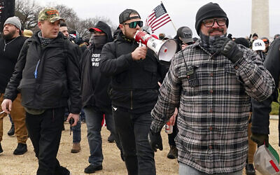 FILE - Proud Boys members including Zachary Rehl, left, Ethan Nordean, center, and Joseph Biggs, walk toward the US Capitol in Washington, in support of President Donald Trump on Jan. 6, 2021. (AP Photo/Carolyn Kaster, fFle)