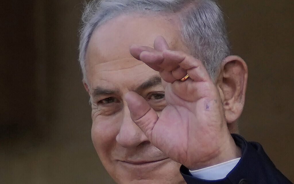 Prime Minister Benjamin Netanyahu waves to the media before a meeting with Cypriot President Nikos Christodoulides at the presidential palace in Nicosia, Cyprus, September 3, 2023. (Petros Karadjias/AP)