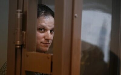 Wall Street Journal reporter Evan Gershkovich stands in a glass cage in a courtroom in Moscow, Russia, on April 18, 2023. (Alexander Zemlianichenko/AP)