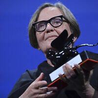 Polish director Agnieszka Holland poses with the 'Special Jury Prize' award for 'Zielona Granica' after the closing ceremony for the 80th edition of the Venice Film Festival in Venice, Italy, Sept. 9, 2023. (Gian Mattia D'Alberto/LaPresse via AP)
