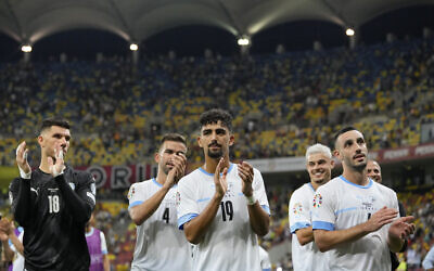 Israel's players applaud their fans at the end of the Euro 2024 qualifying soccer match between Romania and Israel at the National Arena stadium in Bucharest, Romania, September 9, 2023.(AP Photo/Andreea Alexandru)