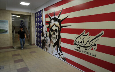 A man walks through the former US Embassy, which has been turned into an anti-American museum in Tehran, Iran, on August 19, 2023. (Vahid Salemi/AP)
