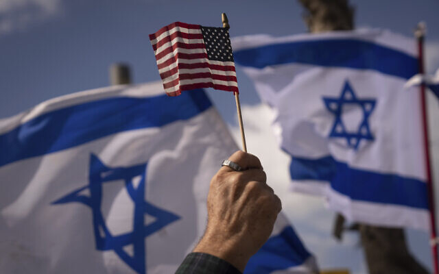 File: Protesters opposed to the coalition's controversial judicial overhaul proposals wave Israeli and American flags during a protest in support of US President Joe Biden, outside of the US Embassy Branch Office in Tel Aviv, Israel, March 30, 2023. (AP Photo/Oded Balilty)