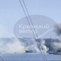 This image taken from UGC video shows smoke rising from the headquarters of Russia’s Black Sea Fleet in Sevastopol, Crimea, September 22, 2023. (Crimean Telegram channel via AP)
