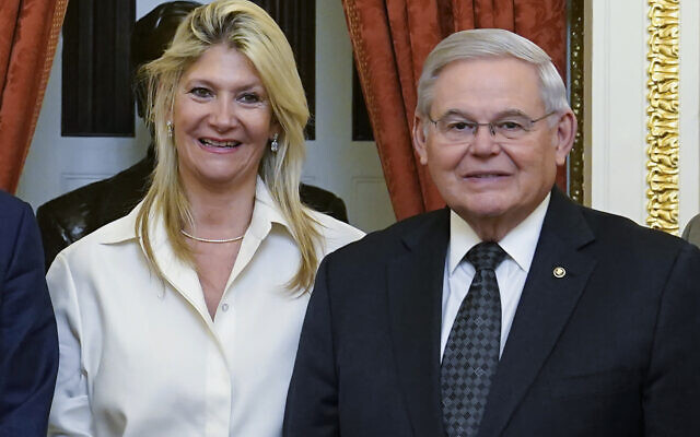 US Senate Foreign Relations Committee Chairman, Sen. Bob Menendez, D-N.J., right, and his wife Nadine Arslanian, pose for a photo on Capitol Hill in Washington, Dec. 20, 2022. (AP Photo/Susan Walsh, File)