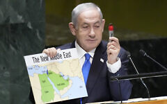 Prime Minister Benjamin Netanyahu prepares to use a red marker on a map of 'The New Middle East,' as he addresses the 78th session of the United Nations General Assembly, Friday, Sept. 22, 2023. (AP Photo/Mary Altaffer)