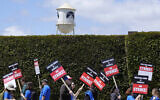 Striking writers take part in a rally in front of Paramount Pictures studio, Tuesday, May 2, 2023, in Los Angeles. A tentative deal was reached, Sunday, September 24, 2023, to end Hollywood’s writers strike after nearly five months. (AP Photo/Chris Pizzello, File)