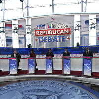 Republican presidential candidates, from left, North Dakota Gov. Doug Burgum, former New Jersey Gov. Chris Christie, former UN Ambassador Nikki Haley, Florida Gov. Ron DeSantis, entrepreneur Vivek Ramaswamy, Sen. Tim Scott, R-South Carolina, and former Vice President Mike Pence, stand at their podiums during a Republican presidential primary debate hosted by FOX Business Network and Univision, at the Ronald Reagan Presidential Library in Simi Valley, California,  September 27, 2023. (Mark J. Terrill/AP)