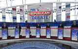 Republican presidential candidates, from left, North Dakota Gov. Doug Burgum, former New Jersey Gov. Chris Christie, former UN Ambassador Nikki Haley, Florida Gov. Ron DeSantis, entrepreneur Vivek Ramaswamy, Sen. Tim Scott, R-South Carolina, and former Vice President Mike Pence, stand at their podiums during a Republican presidential primary debate hosted by FOX Business Network and Univision, at the Ronald Reagan Presidential Library in Simi Valley, California,  September 27, 2023. (Mark J. Terrill/AP)