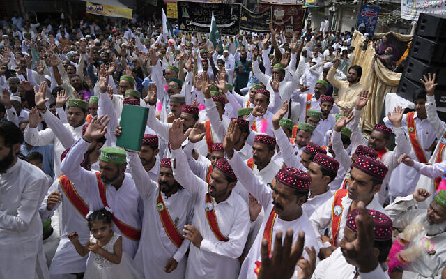 Muslims chant religious slogans during a rally celebrating the birthday of Islam's Prophet Muhammad, in Rawalpindi, Pakistan, Friday, Sept. 29, 2023. Thousands of Muslims take part in religious processions, ceremonies and distributing free meals among the poor to mark the holiday. (AP/Anjum Naveed)
