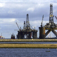 North Sea oil exploration platforms lie in the Cromerty Firth in northern Scotland on March 2, 2003. (AP/Martin Cleaver)