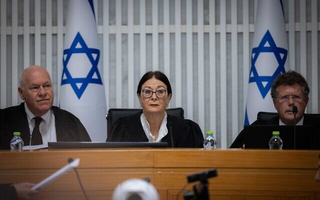 High Court Chief Justice Esther Hayut (center) and justices Isaac Amit (right) and Uzi Vogelman at a court hearing on petitions against the government's reasonableness law at the Supreme Court in Jerusalem, September 12, 2023. (Yonatan Sindel/Flash90)
