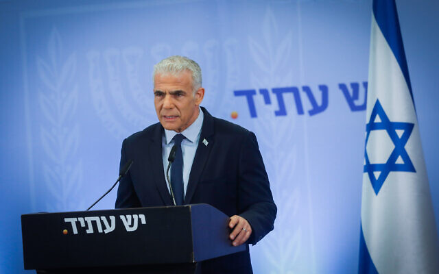 Opposition Leader MK Yair Lapid speaks ahead of his Yesh Atid party's parliamentary faction meeting in Tel Aviv, September 20, 2023. (Miriam Alster/Flash90)