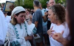 Secular and Orthodox Israelis at a contested public prayer service in Dizengoff Square, Tel Aviv, on Yom Kippur, September 24, 2023. (Tomer Neuberg/Flash90)
