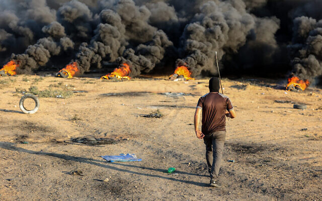 Clashes between Palestinian rioters and Israeli troops near the border between Israel and the Gaza Strip on September 25, 2023 (Atia Mohammed/Flash90)