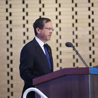 President Isaac Herzog speaks at a state ceremony marking 50 years since the Yom Kippur War at the Mount Herzl military cemetery in Jerusalem, September 26, 2023. (Chaim Goldberg/FLASH90)