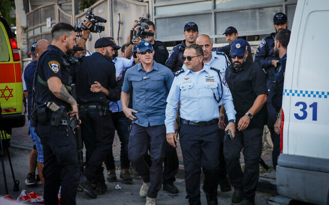 Israel Police Chief Kobi Shabtai, second right, arrives at the scene where five family members were shot to death in the northern Israeli Bedouin town of Basmat Tab’un, September 27, 2023. (Shir Torem/Flash90)