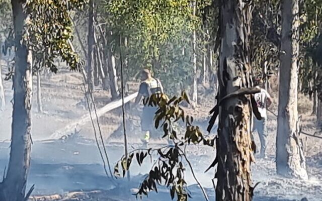 Firefighters putting out a blaze in the Be'eri Forest on September 27, 2023. (Courtesy KKL forestry staff)
