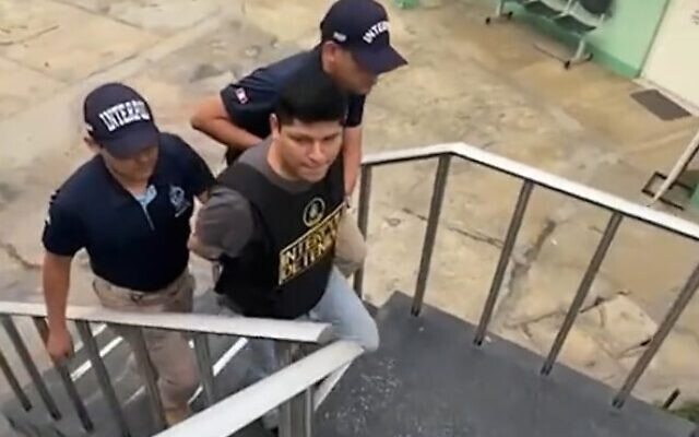 Peruvian Police escorting Eddie Manuel Nunez Santos, 33, who made string of bomb threats to US institutions including synagogues, in Lima, Peru, September 26, 2023. (Twitter video screenshot: used in accordance with Clause 27a of the Copyright Law)
