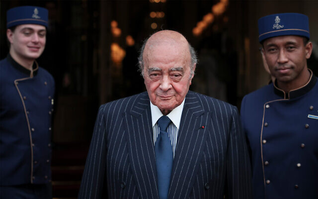 FILE - Egyptian businessman and Ritz hotel owner Mohamed Al Fayed poses with his hotel staff in Paris, June 27, 2016. (AP Photo/Kamil Zihnioglu, File)