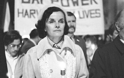 Then San Francisco Mayor Dianne Feinstein carries a candle as she leads an estimated 15,000 marchers also carrying candles during a procession in memory of slain Mayor George Moscone and Supervisor Harvey Milk in San Francisco, November 28, 1979. (AP Photo/Paul Sakuma, File)