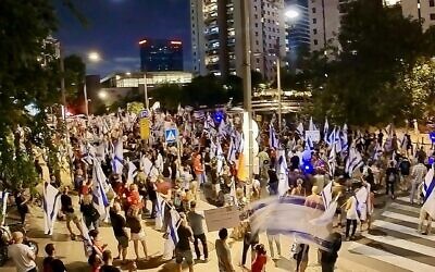 In a photo provided by anti-government activists, protesters against the coalition's judicial overhaul protest outside the home of Knesset speaker Amir Ohana, in Tel Aviv, September 23, 2023. (@sha_b_p)