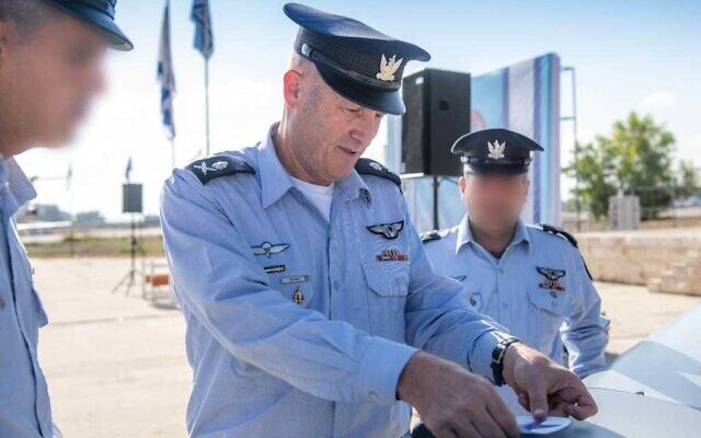 Israeli Air Force chief Maj. Gen. Tomer Bar places the roundel of the IAF on the new 'Spark' UAV, during a ceremony September 10, 2023. (IDF)