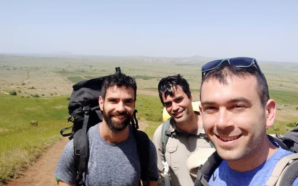 Iddo Gefen, center, seen hiking with his friend Sagi Golan, left, and another friend in an undated photo. (Courtesy of Gefen/via JTA)