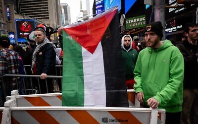Pro-Palestinian activists during a protest in New York City, October 8, 2023. (Luke Tress/Times of Israel)