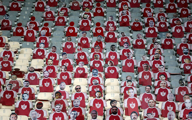 Life-size cutouts depicting a crowd of spectators are placed in empty seats during the AFC Champions League group E football match between Persepolis FC and al-Nassr FC at Tehran's Azadi stadium, on September 19, 2023. (Photo by ATTA KENARE / AFP)