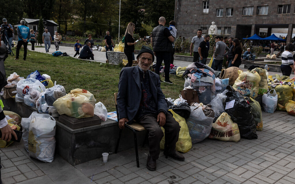 Armenian refugees from Nagorno-Karabakh are seen in the center of the town of Goris on September 30, 2023 before being evacuated in various Armenian cities. (Diego Herrera Carcedo/AFP)
