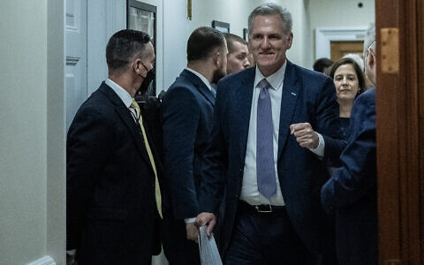 US Speaker of the House Kevin McCarthy, Republican of California, celebrates after meeting with House Minority Leader Hakeem Jeffries, Democrat of New York, on Capitol Hill in Washington, DC, on September 30, 2023. (Photo by Andrew CABALLERO-REYNOLDS / AFP)