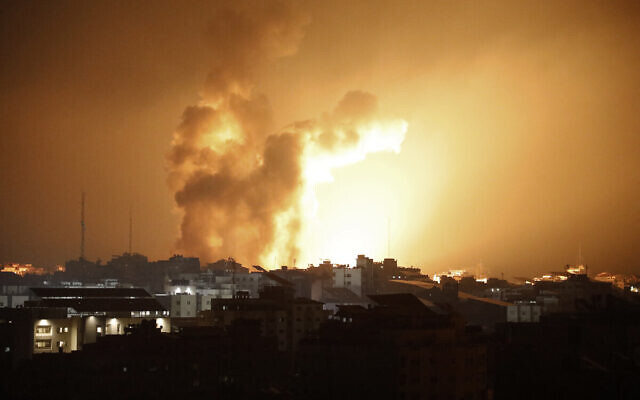 Fire and smoke rises above buildings during an Israeli air strike in Gaza City on October 8, 2023. (EYAD BABA / AFP)