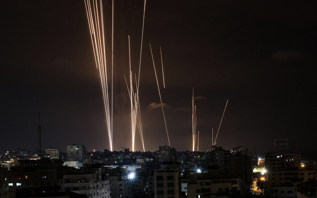 A salvo of rockets is fired by Palestinian terrorists from the Gaza City toward Israel on October 7, 2023. (MAHMUD HAMS / AFP)