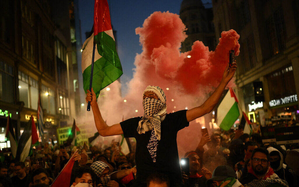People take part in a 'Stand with Palestine' demonstration, close to the Israeli embassy, in West London, on October 9, 2023. (Daniel LEAL/AFP)