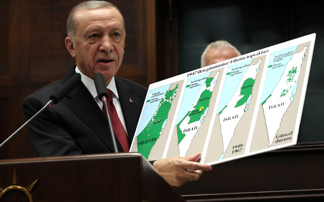 Turkish President and AK Party Chairman Recep Tayyip Erdogan holds a sign showing the evolution of lands in Israel on maps at his party's group meeting in the Turkish Grand National Assembly in Ankara on October 11, 2023. (Photo by Adem ALTAN / AFP)