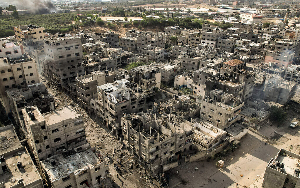 This picture taken on October 11, 2023 shows an aerial view of buildings destroyed by Israeli air strikes in the Jabalia refugee camp in Gaza City. (Yahya HASSOUNA / AFP)