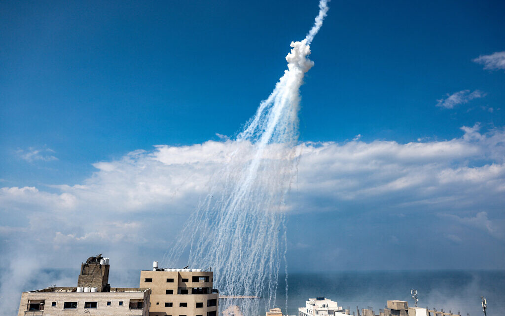 Smoke from Israeli bombardment is pictured over the Gaza City seaport on October 11, 2023. (MOHAMMED ABED / AFP)