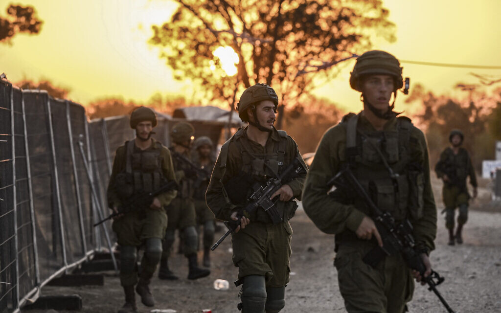 Israeli soldiers patrol on October 12, 2023 near Kibbutz Beeri. (Aris MESSINIS / AFP)
