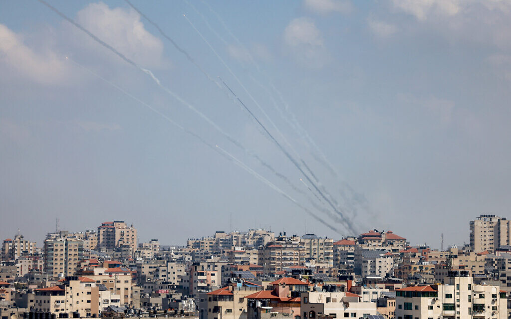 A salvo of rockets is fired by Hamas terrorists towards Israel in Gaza City on October 13, 2023. (MOHAMMED ABED / AFP)