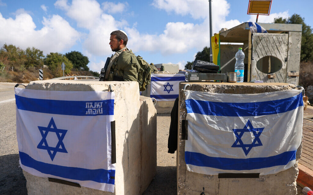 An Israeli soldier mans a checkpoint near the northern Kibbutz Sasa close to the border with Lebanon on October 17, 2023 (Jalaa MAREY / AFP)