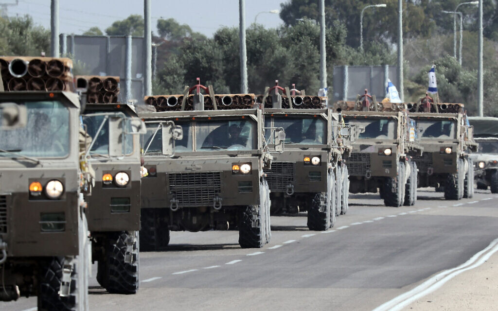 A convoy of Israeli army trucks carrying mortar shells advances on a road near the southern city of Sderot, October 23, 2023. (Thomas COEX / AFP)