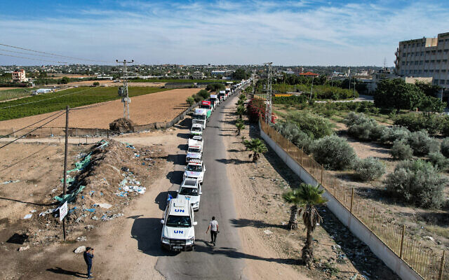 This aerial view shows humanitarian aid trucks arriving at a storage facility in Khan Younis in the southern Gaza Strip on October 21, 2023, after having crossed through the Rafah border from Egypt. (Belal Al Sabbagh/AFP)