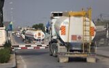 Trucks carrying fuel drive in the Gaza Strip on October 22, 2023. (Mohammed Abed/AFP)