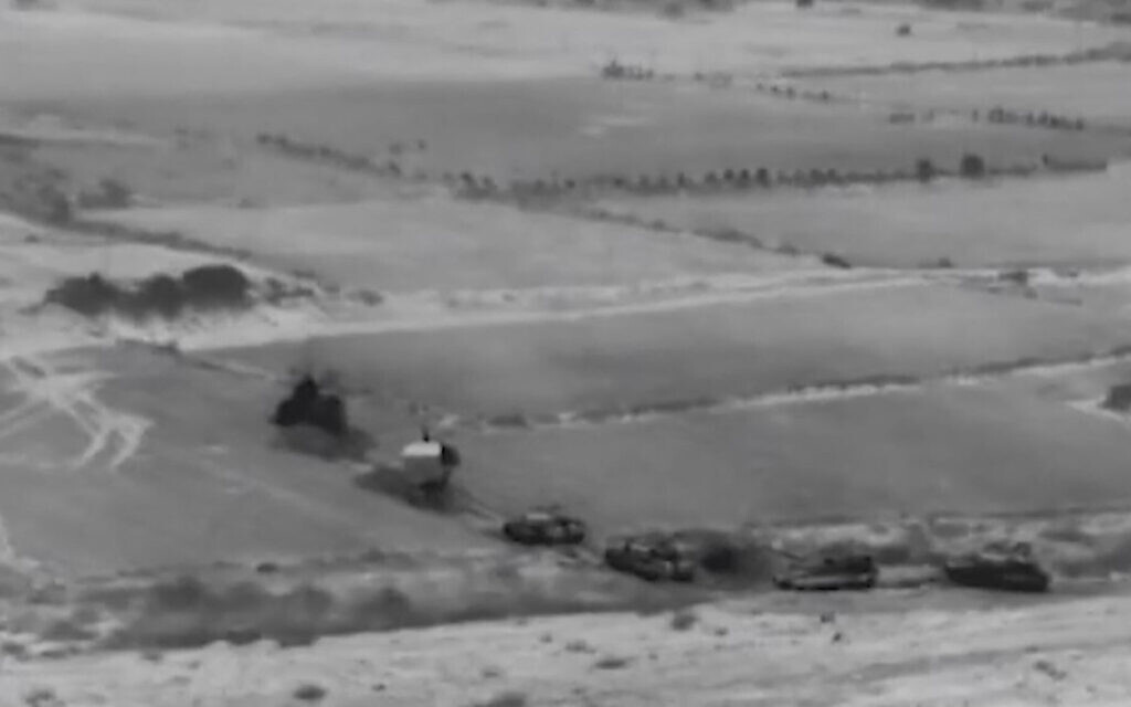 This screen grab taken from handout footage released by the Israeli army on October 26, 2023, shows a "targeted raid" in northern Gaza with tanks and infantry.  (Israeli Army / AFP)
