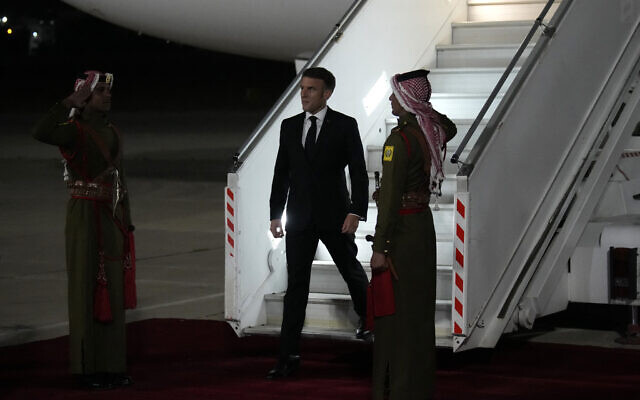 French President Emmanuel Macron arrives in Amman, Jordan on October 24, 2023  (Photo by Christophe Ena / POOL / AFP)
