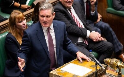 Photograph released by the UK Parliament shows Britain's main opposition Labour Party leader Keir Starmer speaking during the weekly session of Prime Minister's Questions, at the House of Commons, in London, on October 25, 2023. (Photo by Maria Unger / UK Parliament / AFP)